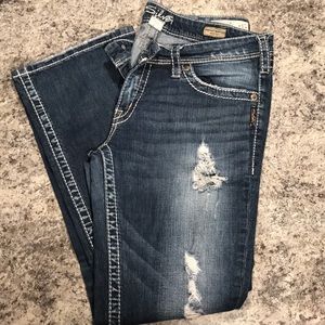 Woman’s silver jeans